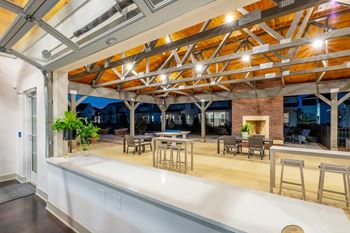 4,200 Sq. Ft. Indoor/outdoor pavilion featuring an outdoor fireplace, bar & games